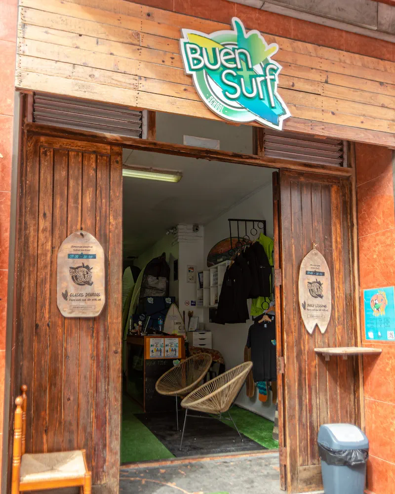 The open front of Buen Surf School, with the sign above the doorway